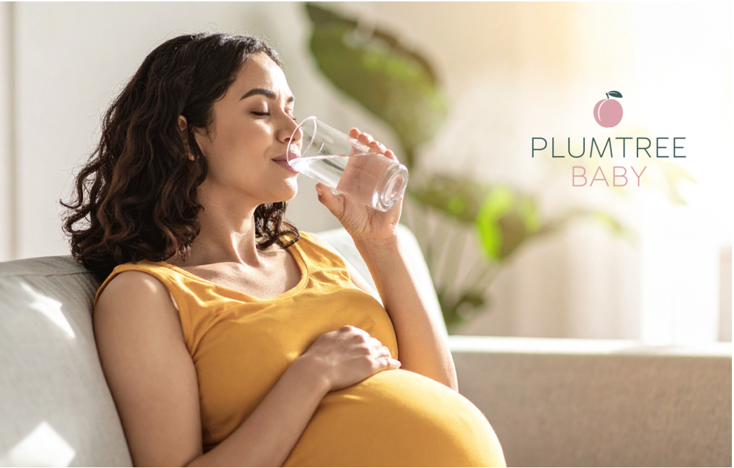 A pregnant woman drinking water in labor