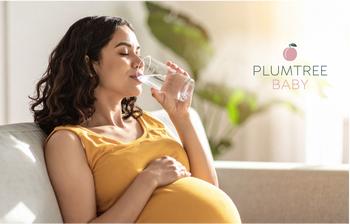 A pregnant woman drinking water in labor